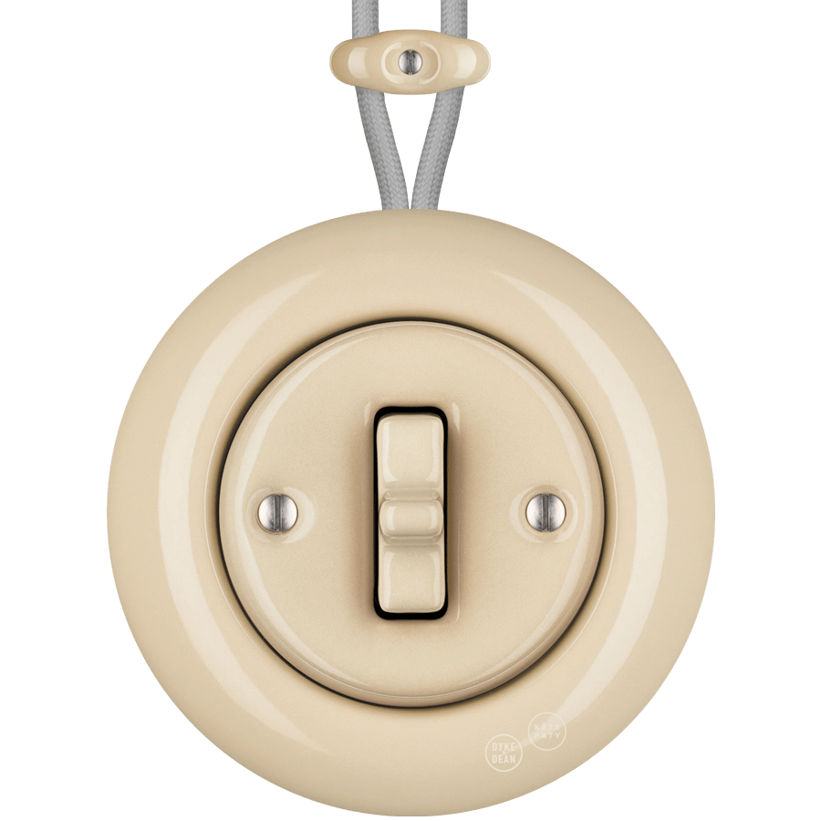 PORCELAIN KATY PATY COLONA ROUND SURFACE MOUNTED TOGGLE BUTTON SWITCH SAND - DYKE & DEAN