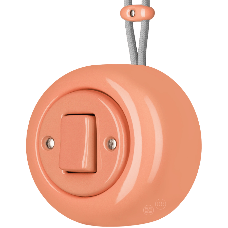 PORCELAIN ROUND SURFACE MOUNTED FAT BUTTON SWITCH SALMON PINK - DYKE & DEAN