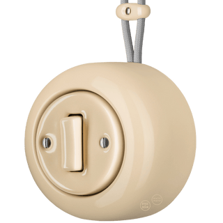 PORCELAIN ROUND SURFACE MOUNTED SLIM BUTTON SWITCH SAND - DYKE & DEAN
